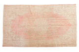 Vintage distressed Oushak carpet with decorative faded blush and ivory floral patterns, 6'2