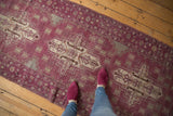 Textured aubergine Oushak runner with ivory stepped medallions and mostly even wear.