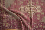 Textured distressed Oushak runner with aubergine and slate stepped geometric motifs and visible wear.