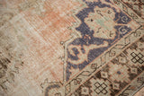 Distressed vintage Oushak rug texture, knot heads, foundation, dusty rose, and dark blue.