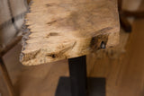 Natural textured live edge of the reclaimed wood table top.