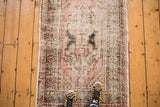 Distressed vintage Oushak rug, faded cherry red medallion with charcoal and sand.