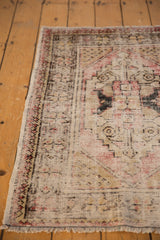 Textural detail of the distressed Oushak rug, showing mostly even wear and foundation.