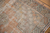 Distressed vintage Oushak runner with geometric border, faded tangerine and oxidized silver tones.