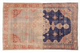 Distressed Sivas rug with dramatic abrash field, scalloped medallion, raspberry, silver, navy.