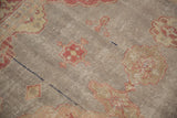 Worn raspberry and blush floral motifs on distressed silver Sivas rug.