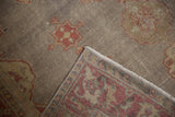 Distressed Sivas rug corner: worn knot heads visible, raspberry red motifs on reverse.