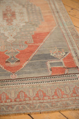 Distressed Oushak runner's blush rust and silver abrash patterns with visible wear.