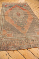 Distressed fringe and geometric border pattern on the vintage Oushak rug runner.