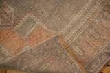 Distressed Oushak rug runner's textured pile with abrashes and its woven reverse.