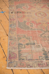 Distressed Oushak rug runner border, low pile texture with dusty rose, charcoal, and ivory.