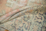 Textured pile of a vintage Oushak rug with blush, oxidized silver, and blue colors.