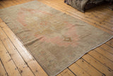 Vintage distressed Oushak runner, pale blush and sand field, even wear and foundation showing.