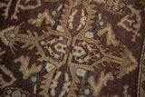 Distressed aubergine field, intricate rams horn vinery, beige motifs with aqua accents.