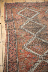 Distressed vintage Oushak runner with mostly even wear, faded red and charcoal geometric diamonds.