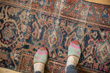 Vintage Mahal rug with even wear, featuring rich rust, navy, and beige intricate patterns.
