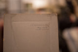 Handwritten date of August 1907 on the aged cardboard back of an antique photograph.