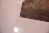 The printed text 'Now I Lay Me Down to Sleep' on the corner of the vintage lithograph.