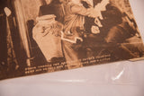 Original caption and copyright mark at the bottom of the antique 1920s film still.