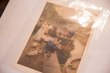 Vintage Hans Herrmann print of a flower market seen from an angle in its protective sleeve.