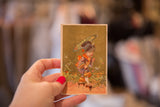 Hand-painted antique Asian lithograph card with child in kimono, golden background.