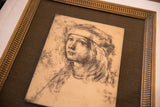 Textured surface of the vintage Artini engraving with ornate gold frame.