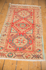 Distressed Oushak rug with cherry red, aqua geometric hook and latch motifs.