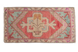 Distressed vintage Oushak rug mat, tree-of-life medallion, blush, mint, ivory tones.