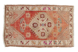 Vintage Distressed Oushak rug, abrashed floral medallion in cherry red, beige hues, 1'9