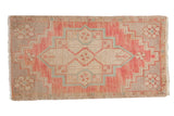 Distressed Oushak rug mat with blush, beige, and blue oversized medallion, 1'6