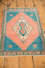 Vintage distressed Oushak rug: apricot peach field, deep turquoise stepped spandrel, vinery.