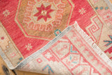 Hand knotted foundation, fringe, and distressed cherry red vintage Oushak rug.