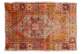 Vintage distressed Oushak rug with diamond medallion, aubergine, saffron, and pink tones, 2'9