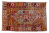 Distressed vintage Oushak rug, aubergine and gold medallion on a pale mauve field, 2'9