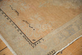 Vintage Distressed Oushak rug corner detailing pale terra cotta field, geometric charcoal border, and aged ivory spandrel.