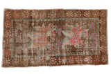 Distressed vintage Oushak rug with large floral bouquet in brown, pink, and sea foam. 2'7