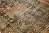 Distressed Oushak rug with recessed pile, exposed foundation, and bronze, sea foam, pink.