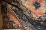 Close-up of vintage Oushak rug's distressed pile, showing foundation and blush, charcoal patterns.