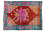 Vintage distressed Oushak rug with cherry red field, pink medallion, and aqua border.
