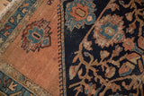 Worn floral vinery and palmettes, with tattered fringe, on vintage Persian Malayer rug corner.