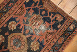 Lilihan rug's Mina Khani floral motif in navy, blush, and sky blue with areas of wear.