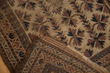 Worn pile texture of chocolate, navy starburst floral motif and tattered end, antique Belouch rug.