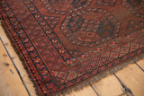 Vintage Ersari carpet perimeter with wine red, navy blue border and secure overcast stitching.