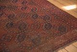 Worn wine red Ersari carpet with navy gul motifs, accented by ivory detail.