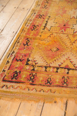 Geometric patterns, worn pile, and tattered fringe on a Vintage Moroccan Murat runner.