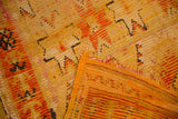 Vintage Murat rug detail with saffron yellow pile, exposed foundation, and tattered edge.