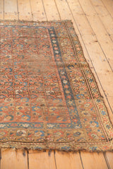 Blush and sky blue multi-column floral bouquet motif of a vintage Kurdish Hamadan rug.