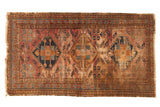 Distressed vintage Malayer rug with triple medallion, Herati field, and pawn border motifs.