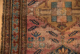 Vintage Malayer rug: worn raspberry field, germinating plants, reciprocating pawn border.