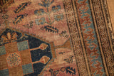 Vintage Malayer rug's large reciprocating pawn border with blue, bronze, and raspberry Herati field.
